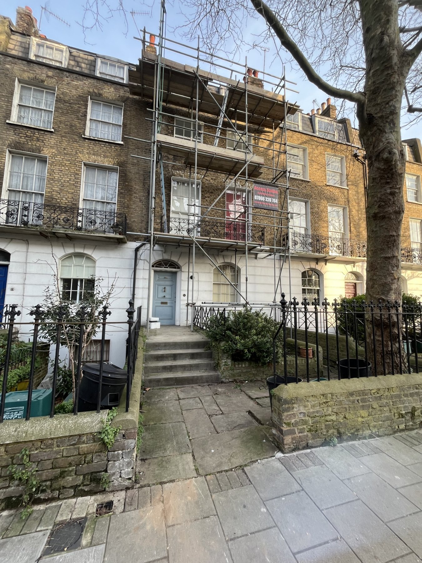 Access Station scaffolding on a London-style residential terrace
